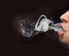 815009-man-blowing-smoke-with-black-background.jpg