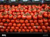 a-display-of-vine-ripened-red-tomatoes-at-a-grocery-store-FWF9AM.jpg