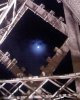 Moon through the Eiffel Tower.jpg