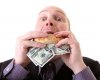 6095924-greed-businessman-eating-money-man-eat-dollars-in-display-of-avarice-isolated-on-white.jpg
