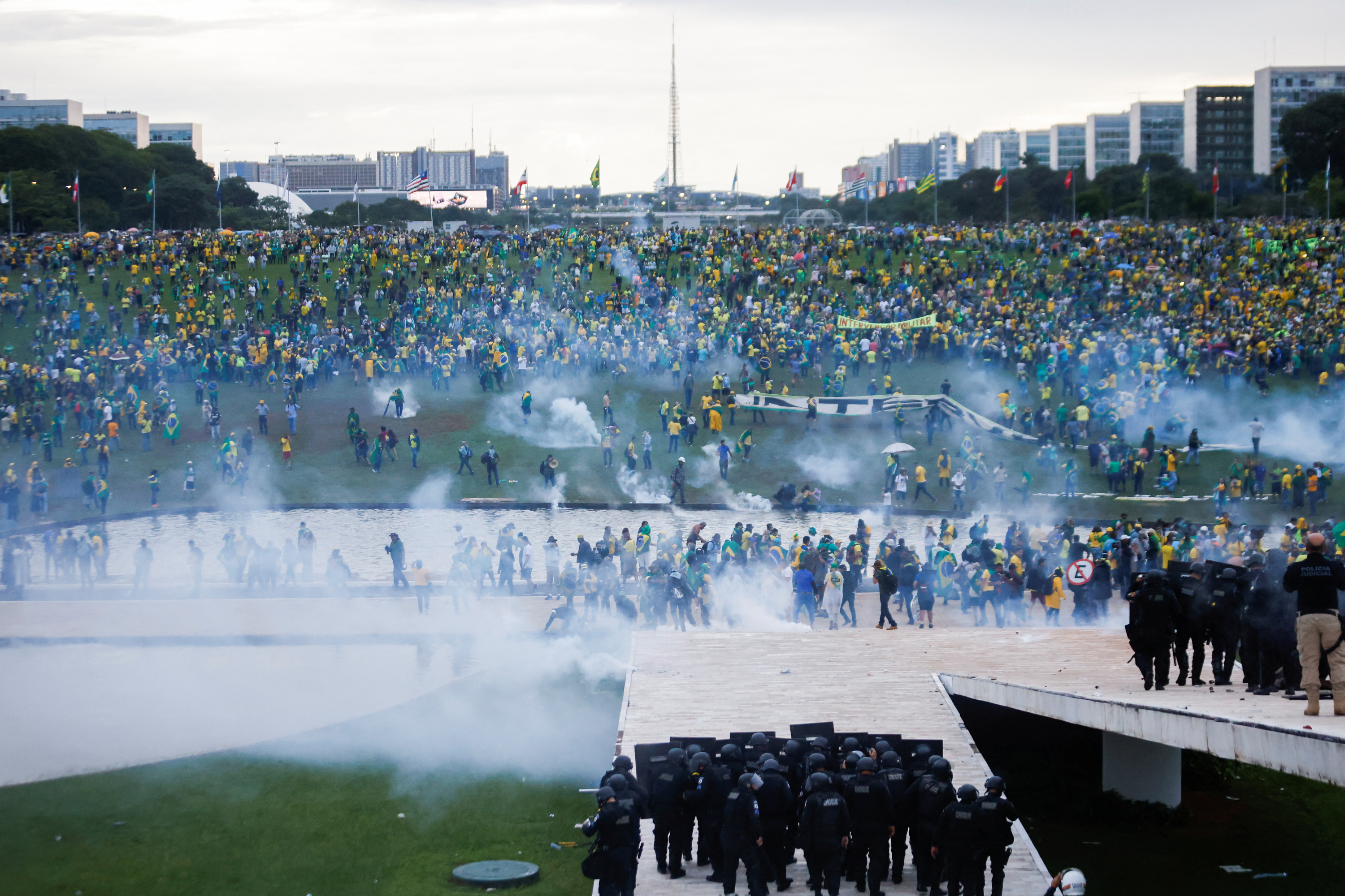 Supporters of Brazil's former President Jair Bolsonaro demonstrate against President Luiz Inácio Lula da Silva as security forces operate outside Brazil’s National Congress in Brasília, Brazil on Sunday.