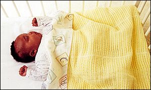 _1431489_baby_in_cot300.jpg