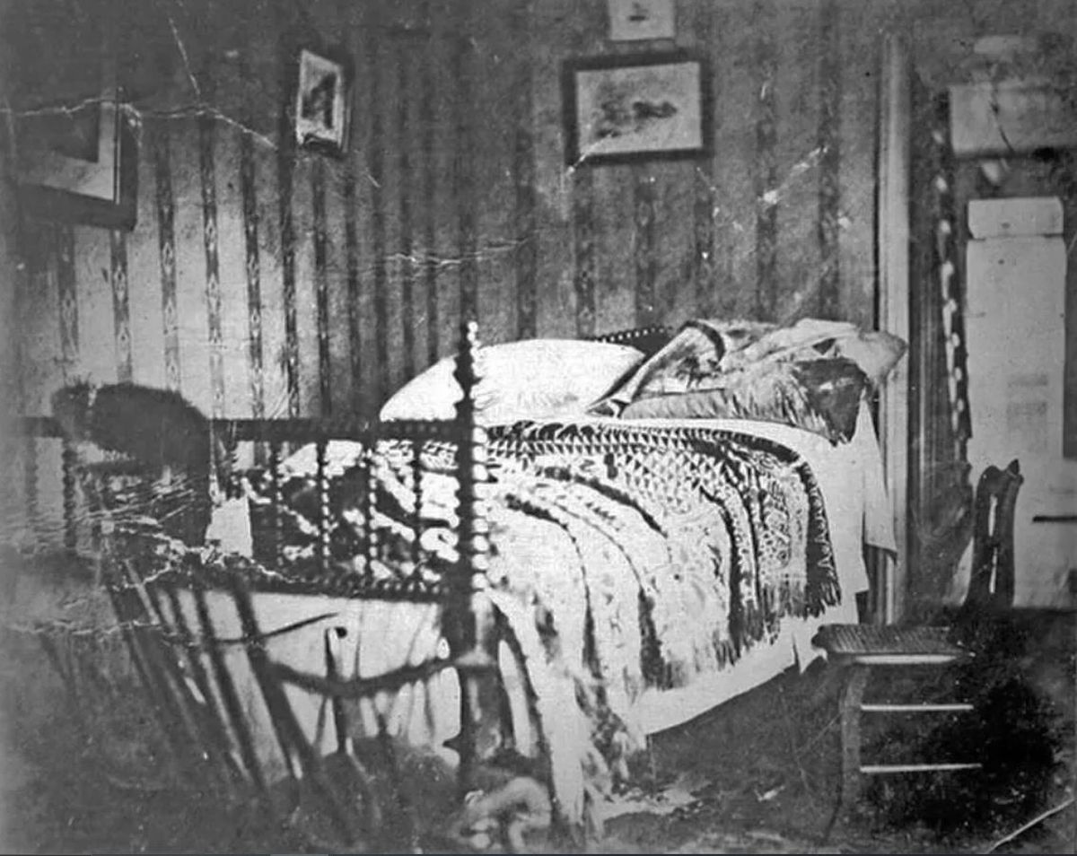 The bed on which Abraham Lincoln died hours after being shot by John Wilkes Booth, taken shortly after Lincoln's body was removed